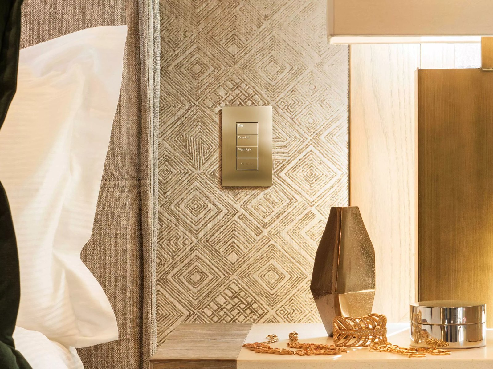 Lutron matte black keypad on a limestone wall