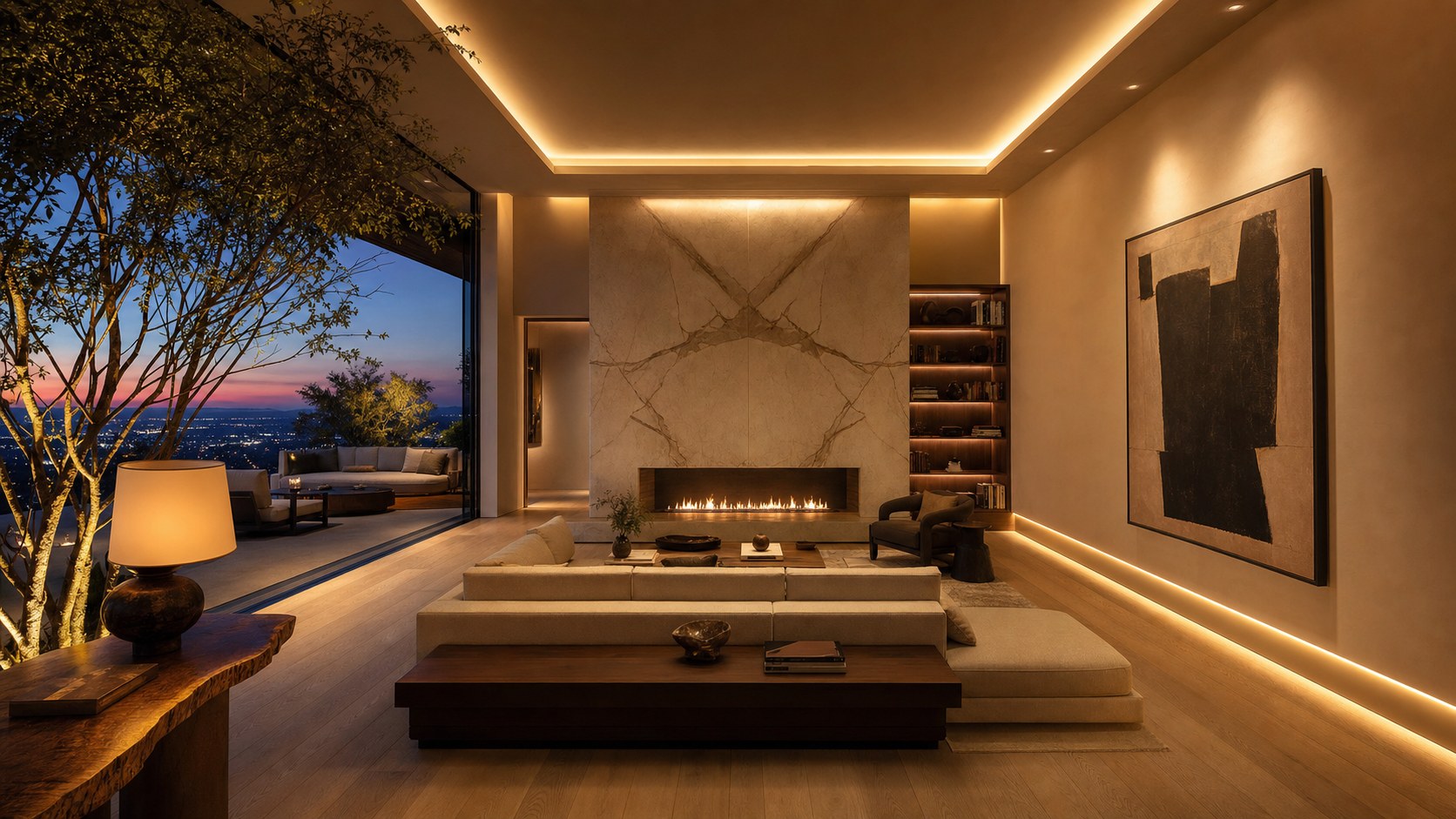Luxury great room at dusk with layered cove lighting, warm-dim downlights washing a plaster fireplace, and integrated bookshelf accent lighting
